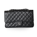 Elevate your style with the Authentic Chanel Classic Flap Bag – Medium Black Caviar, featuring diamond quilting and silver hardware.