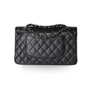 Authentic Chanel Classic Flap Bag – Medium Black Caviar features elegant diamond quilting and silver-tone hardware.